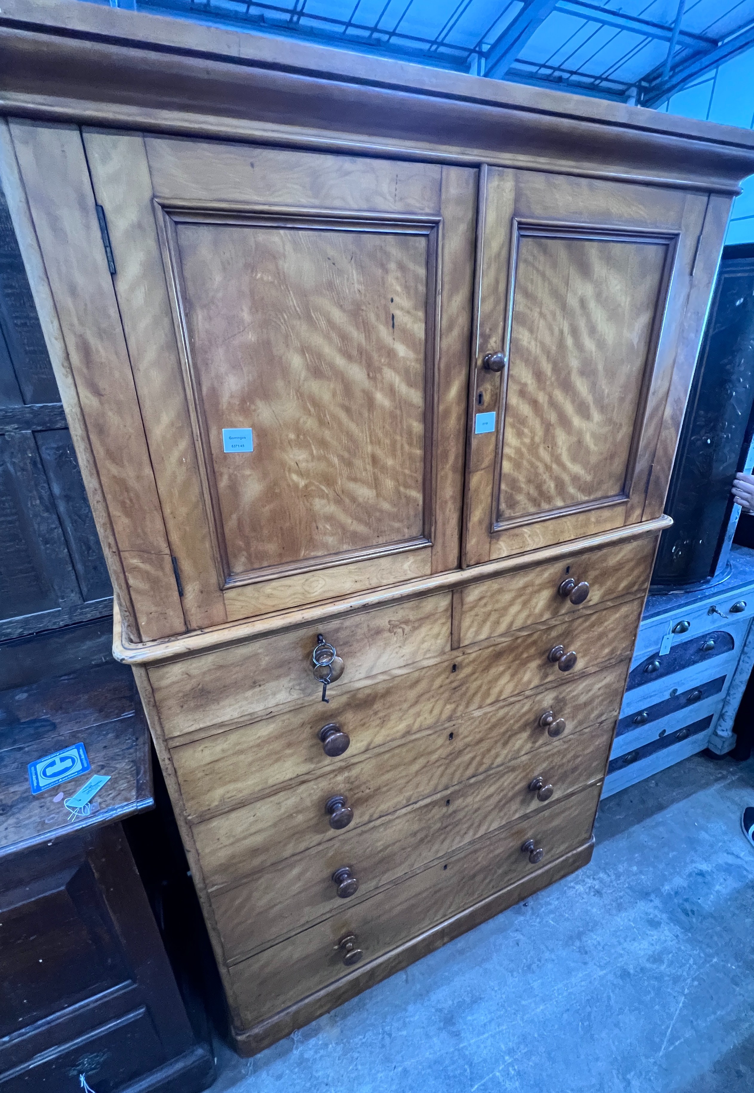 Heal & Son London. A Victorian satin birch press cupboard, width 122cm, depth 53cm, height 188cm